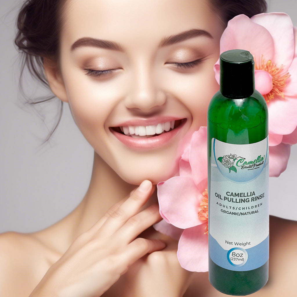 Model with camellia flowers and Perio-Solutions Camellia Dental Products best-selling Camellia Oil-Pulling Rinse