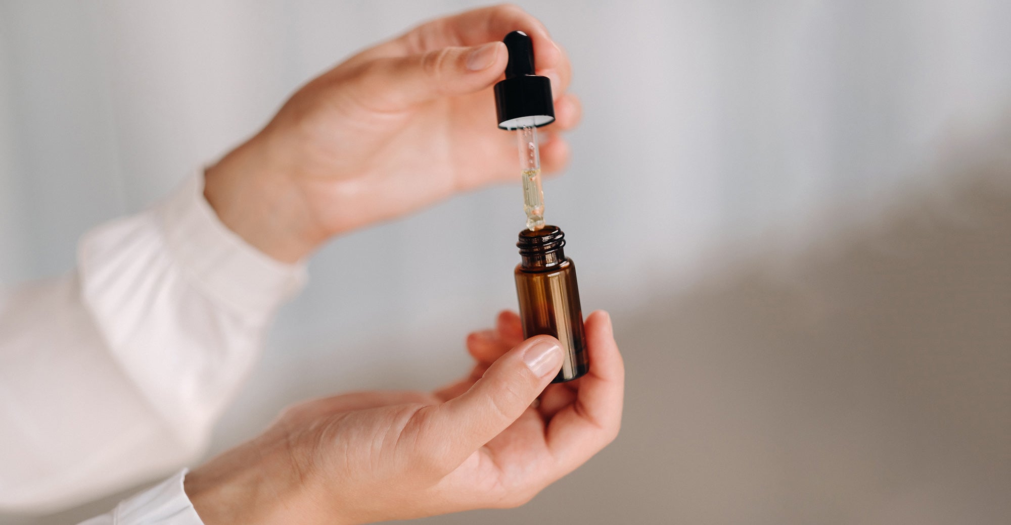 Essential oil in glass dropper bottle